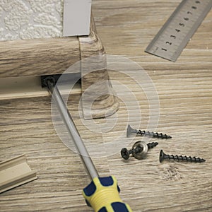 Installation of a plastic skirting on outer corner of floor