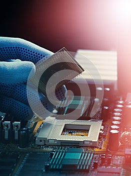 The installation of the processor into the socket of the motherboard.