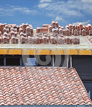 Installation of a roman tile roof on a house