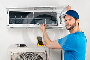 Installation service fix  repair maintenance of an air conditioner indoor unit, by cryogenist technican worker checking the air
