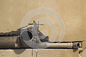 Installation of sewer pipes in a bathroom of an apartment interior during renovation works. Gray plastic drain pipe for used water