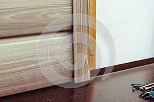 Installation of siding on the facade of the house