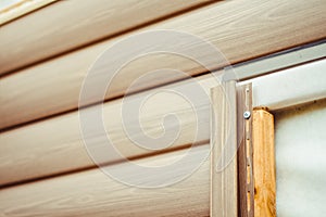 Installation of siding on the facade of the house