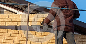 Installation of siding on the walls of the house