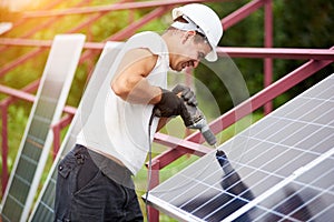 Installation of stand-alone exterior photo voltaic panels system. Renewable green energy generation.