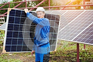 Installation of stand-alone exterior photo voltaic panels system. Renewable green energy generation.