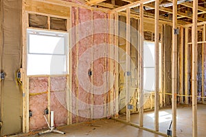 An installation of thermal fiberglass insulation mineral rock wool in a new home