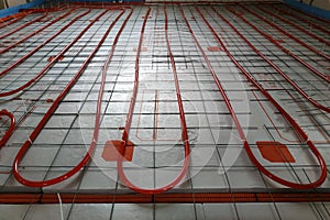 Installation of underfloor heating system, closeup on the water floor of the interior heating system of a new apartment building