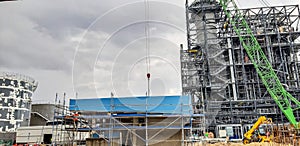 Installation using a concrete structure crane. View from below. The concept of construction of complex metal concrete structures