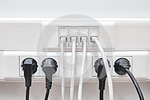 Installation of wires in electrical and local network sockets. Connecting and disconnecting computers in the office lan