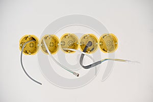 Installation of yellow wall sockets with cable