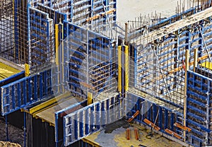 Installed formworks and iron rebars or reinforcing bar for reinforced concrete partitions at the construction site of a large