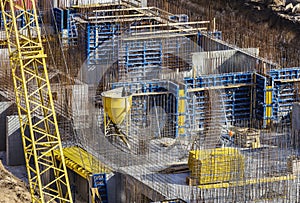 Installed formworks and iron rebars or reinforcing bar for reinforced concrete partitions at the construction site of a large