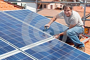 Installing alternative energy photovoltaic solar panels photo