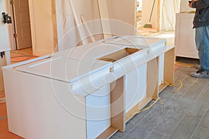 Installing cabinets in a kitchen of white color