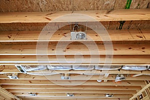 Installing of central conditioning set hvac system a spotlight in new home on wooden beamed ceiling