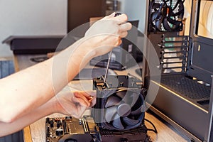 Installing a cooler on a personal computer processor.