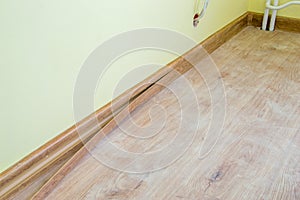 Installing decor strip of floor plastic skirting boards