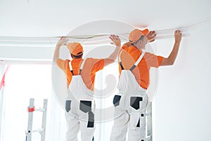 Installing decorative ceiling molding. home repair and decoration