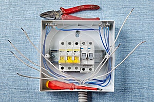 Installing of electric panel with automatic fuses photo