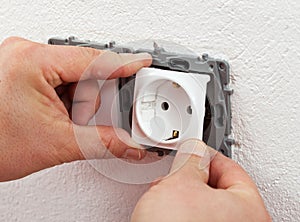 Installing electrical outlet or socket - closeup