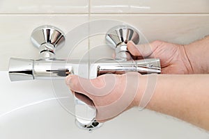 Installing faucet with thermostat.