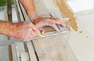 Installing laminate flooring.