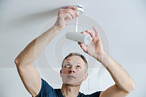 Installing a lamp at home.