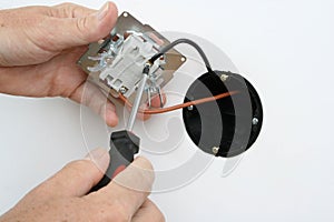 Installing a light switch in a wall socket