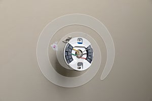 Installing mounting plate for modern round thermostat for air conditioning unit