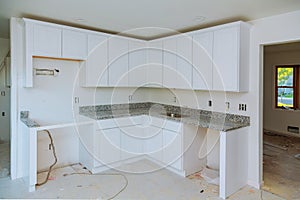 Installing new induction hob in modern kitchen