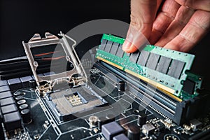 Installing a new RAM DDR memory for a personal computer processor socket in a service. Upgrade repair. PC upgrade or