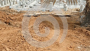 Installing piles, work in laying the foundation building on construction site.