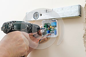 Installing a programmable room thermostat.