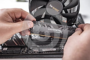 Installing random access memory into PC.