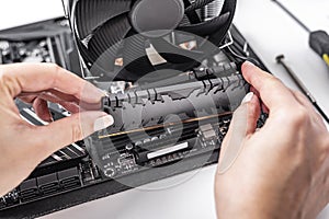 Installing random access memory into PC.