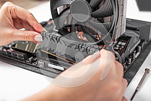 Installing random access memory into PC.