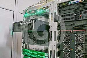 Installing or removing a powerful supercomputer from a rack with equipmentSeveral racks with servers are located in the server