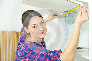 installing shelf under kitchen cupboard