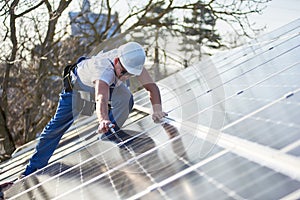 Installing solar photovoltaic panel system on roof of house