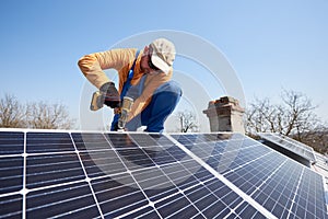 Installing solar photovoltaic panel system on roof of house