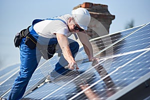 Installing solar photovoltaic panel system on roof of house