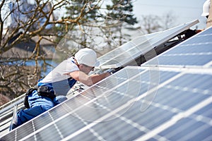 Installing solar photovoltaic panel system on roof of house