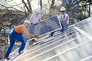 Installing solar photovoltaic panel system on roof of house