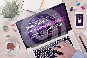 Installing update against meltdown and spectre threat concept on top view laptop screen photo