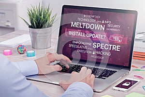 Installing update against meltdown and spectre threat on laptop in office space