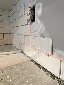 Installing Wall Tiles Using a Laser Level