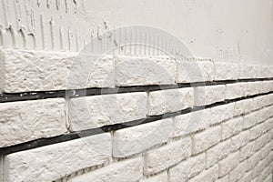 Installing white decorative bricks