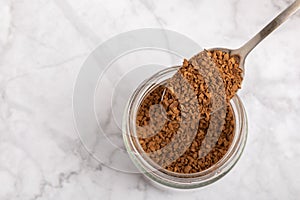 Instant coffee beans in a spoon