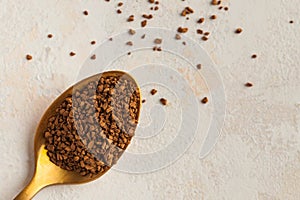 Instant coffee in a Golden spoon. Concept of instant coffee birthday celebration. Copy space. July 24